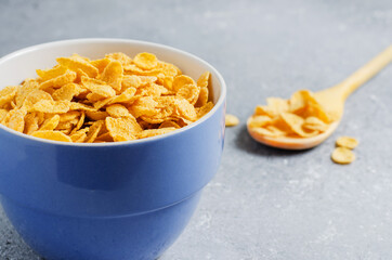 Corn flakes in a plate. Healthy breakfast. Copy space.