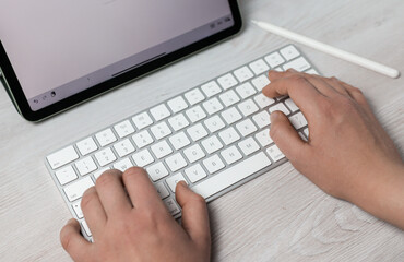 person typing on a laptop