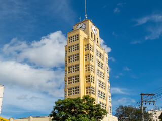 yellow building with clock in the city of Taubaté