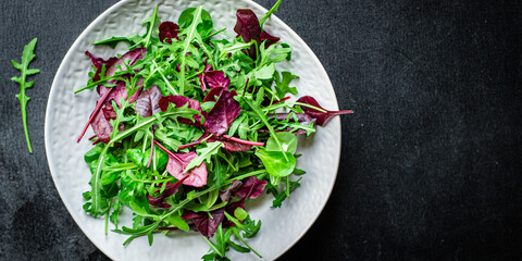 salad lettuce leaves vegetables mix greens portion on the table healthy meal snack outdoor top view...