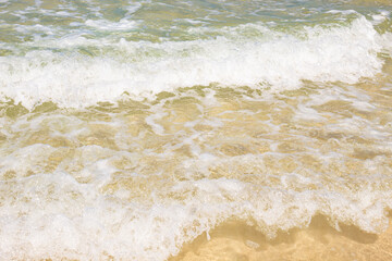 Fototapeta na wymiar waves on the beach located at Atalaia beach, Mariscal beach, Bombinhas, Santa Catarina, Brazil