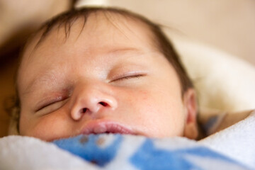 beautiful baby sleeping on a bed, portrait of a sleeping baby boy