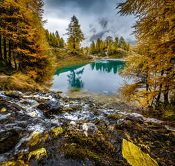 autumn mood over alpine lake in Valais