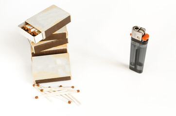 match boxes and lighter on a white background kopi space alternative choice matches and lighter