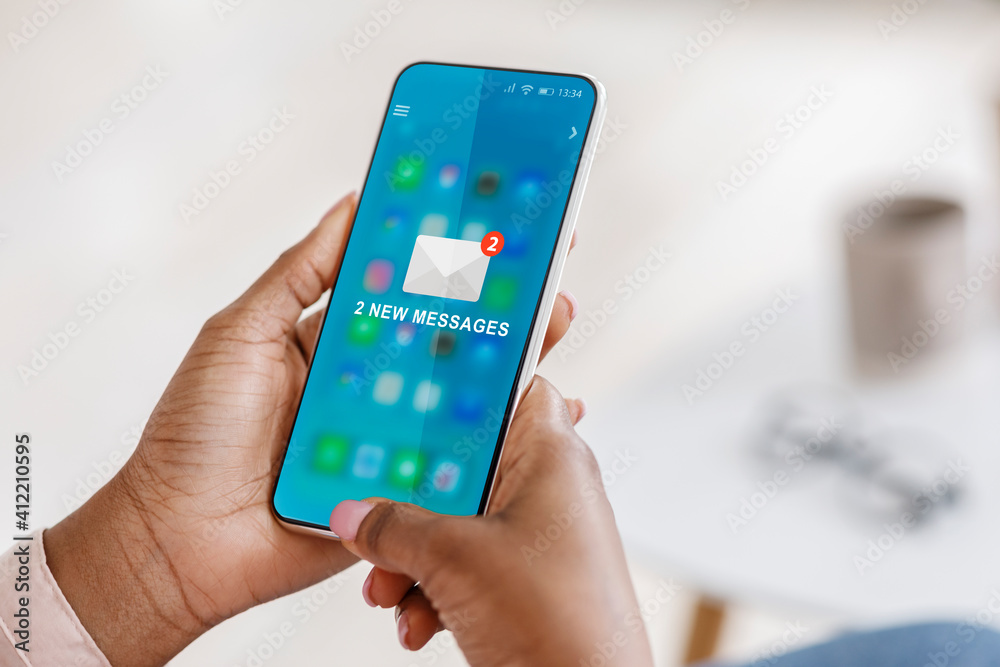 Poster black woman using smartphone with new e-mail message in office
