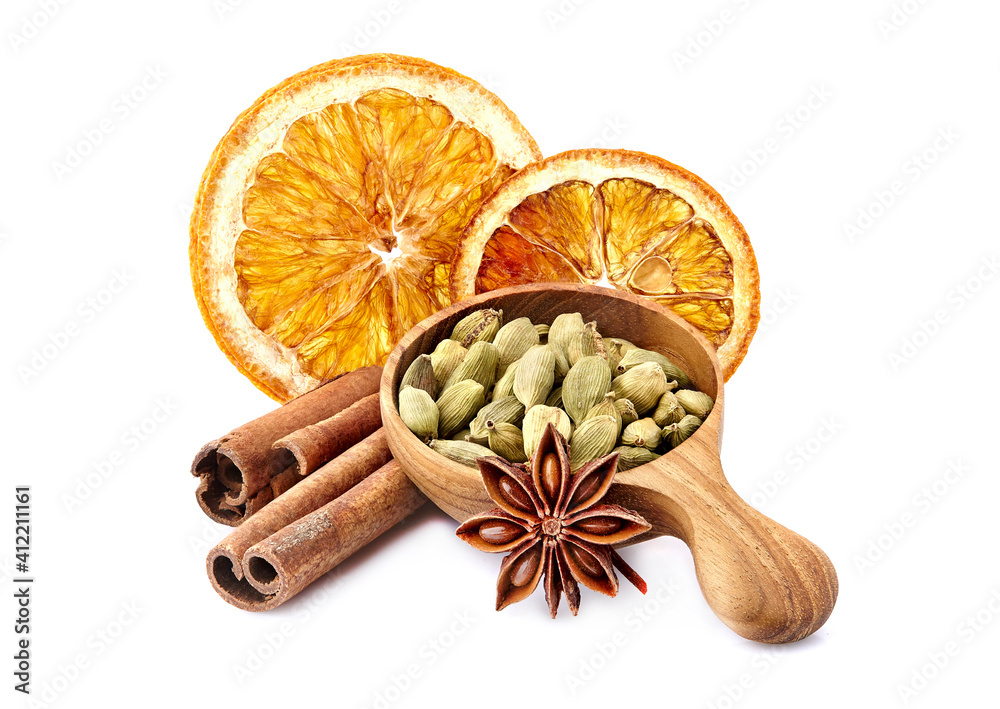 Wall mural cardamom with cinnamon and anise on white background closeup. dry orange with spices closeup.