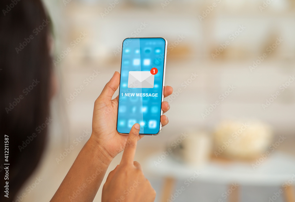 Poster unrecognizable woman using phone reading new email message sitting indoors