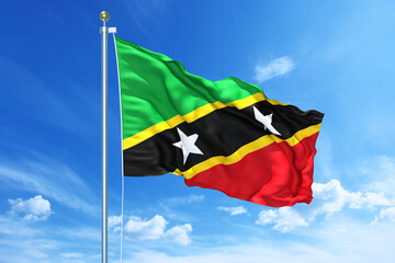 Saint Kitts and Nevis flag waving on a high quality blue cloudy sky, 3d illustration
