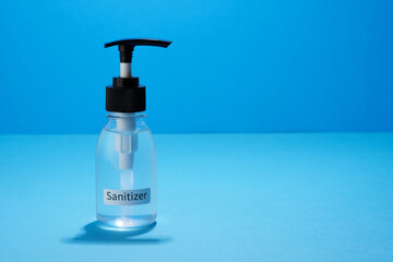 bottle of hand sanitizer on the blue background