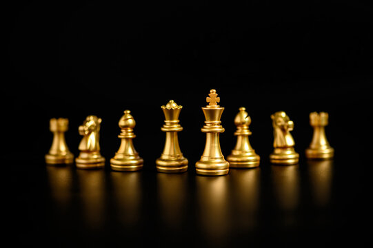 Premium Photo  Golden chess pieces on chess board (ai)