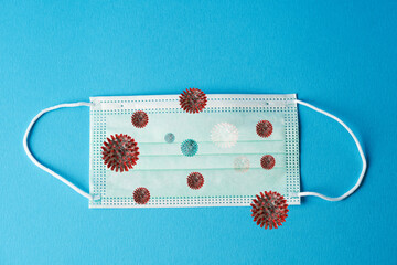 Prevent coronavirus. Medical mask, Medical protective mask on blue background. Disposable surgical...