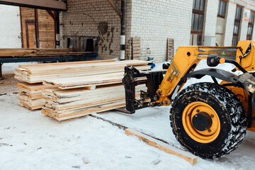 forklift truck with planks, delivery of wood to the warehouse, loading a large number of wooden planks with the help of industrial transport