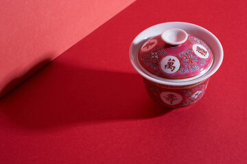 Chinese antique pink tea bowl with chinesecharacter , cover and saucer. word translated attain...