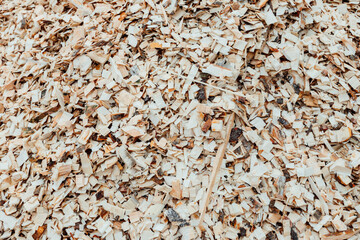 sawdust and wood shavings. background and texture of wood processing waste