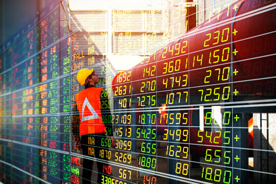 engineer real estate industry, investing stock market real estate. Stock financial index data of construction industry and property development business growth on construction site background image.