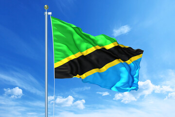 Tanzania flag waving on a high quality blue cloudy sky, 3d illustration