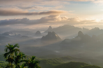 The sun shines through the mountains that swap practice into a beautiful forest.