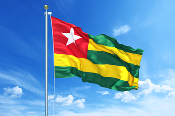 Togo flag waving on a high quality blue cloudy sky, 3d illustration