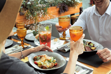 couple having amazing lunch at outdoor restaurant