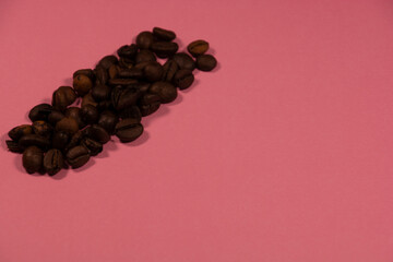 brown roasted coffee beans in front of colorful backdrop as natural theme