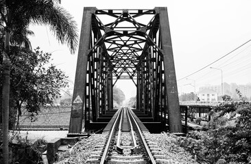 Iron bridge on a railway line in Taling Chan, Bangkok, Thailand, black and white photographed