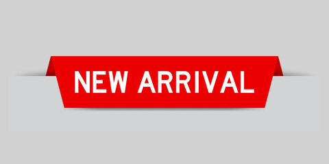 Red color inserted label with word new arrival on gray background