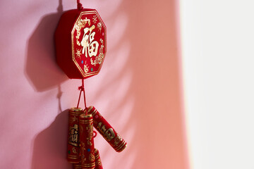   Chinese new year  Firecracker On Red Background (Chinese characters translated  in the article...