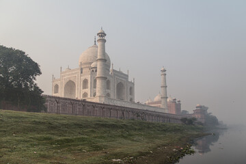 Fototapeta na wymiar Taj Mahal mausoleum in Agra, India. View from the side of Yamuna River.