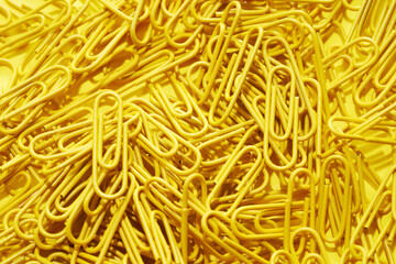 yellow color Paper clips on yellow  background