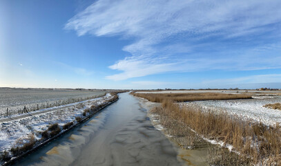 Fototapeta na wymiar Panorama from a frozen canal