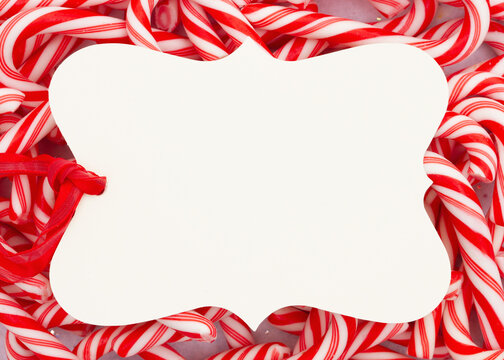 Blank Gift Tag On A Pile Of Candy Canes For Christmas