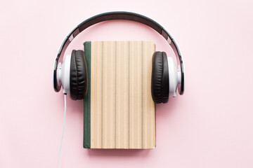Headphones and book Audiobook concept