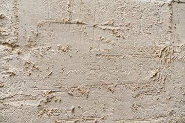 white textured plaster on the wall. Background for texture and design