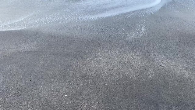 Waves breaking in the mediterranean sea in Nerja, M&aacute;laga while sunset