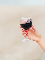 glass of wine on the beach