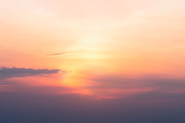 A view of the sky at sunset in vibrant orange pinks and violet colors.