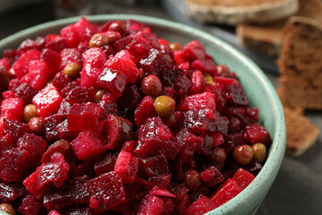 Traditional Russian salad vinaigrette in bowl, closeup