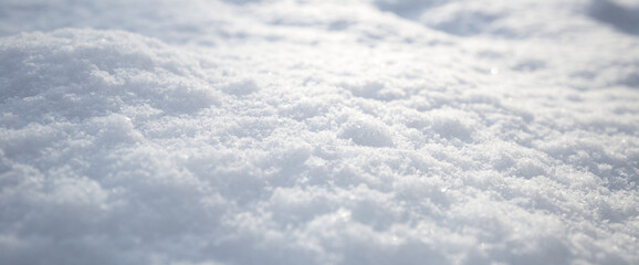 Snow texture. Top view of the white snow. Background with copy space. Winter time