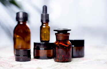 Glass bottles for medicines or cosmetics. Bottles made of dark glass.