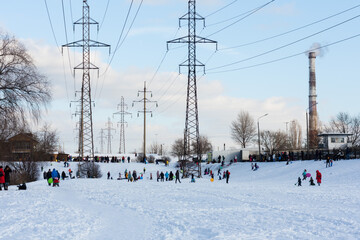 Fototapeta na wymiar High-voltage DC line in a city park near the lake, Kiev, Ukraine