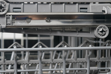 close-up of the mechanisms of the system extensions mesh drawer dishwasher
