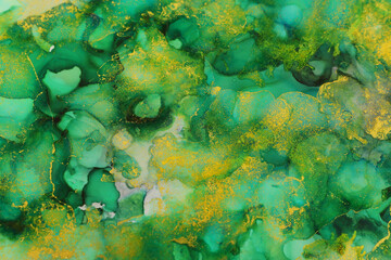 art photography of abstract fluid art painting with alcohol ink, green and gold colors