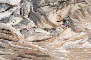 Wood texture with uneven beige relief. Concept background, texture.