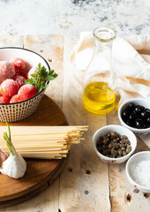 Some ingredients to make puttanesca pasta, a typical italin dish