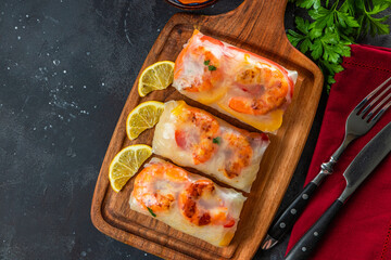  Spring rolls with funchose and shrimps in rice paper on the cutting board top view