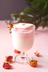 Glass of rose iced Dalgona whipped drink coffee