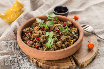 Kuchmachi traditional Georgian dish of chicken livers, hearts and gizzards with walnuts and pomegranate