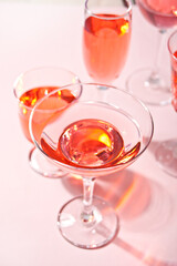 Summer tropical pink cocktail in a different glasses.