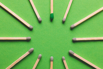 Frame made of matches on color background. Concept of uniqueness