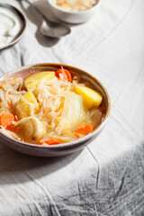 Vegetarian sauerkraut soup shchi with veggies. Comfort healthy food